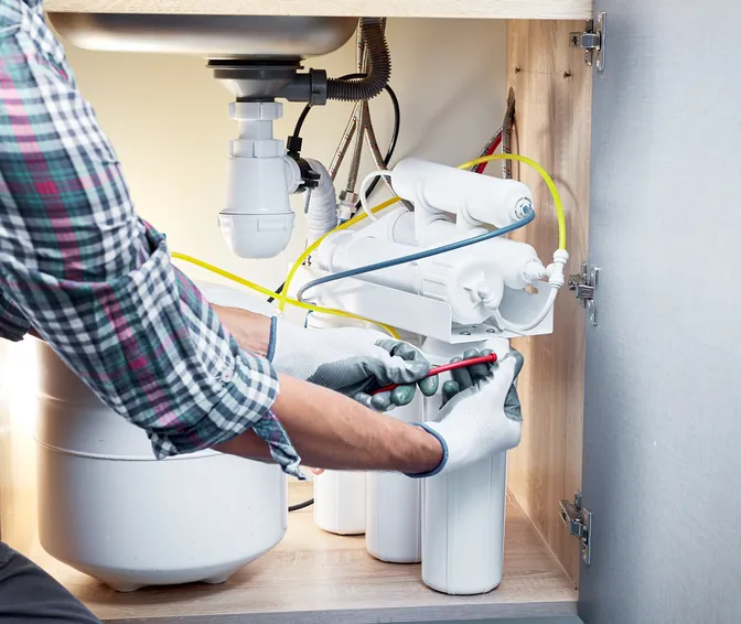 A Guardian Solutions Plus technician servicing a home comfort system